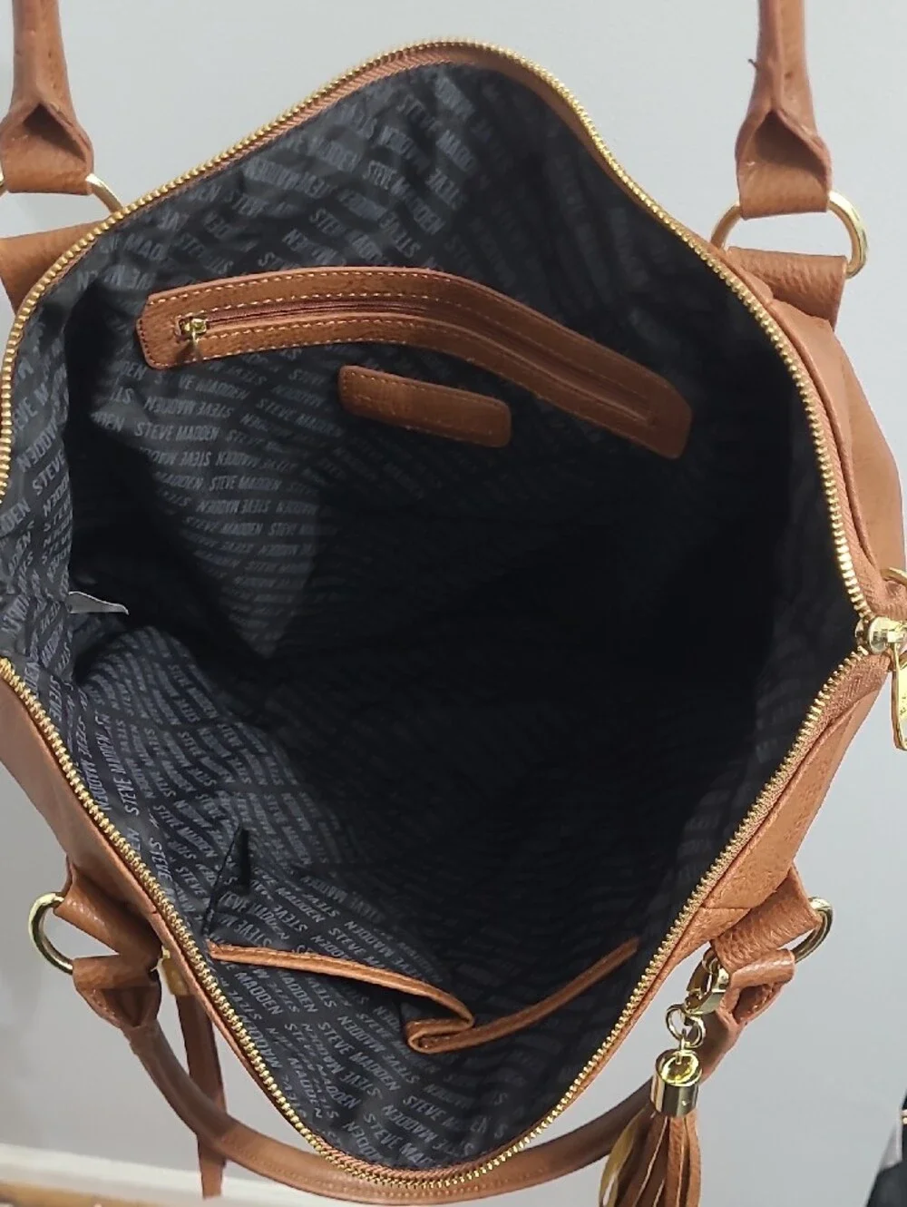 Classic Tan Tote Handbag with Tassel Accent
